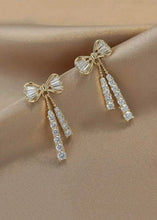 Cargar imagen en el visor de la galería, Bow Detail Tassel Earrings
